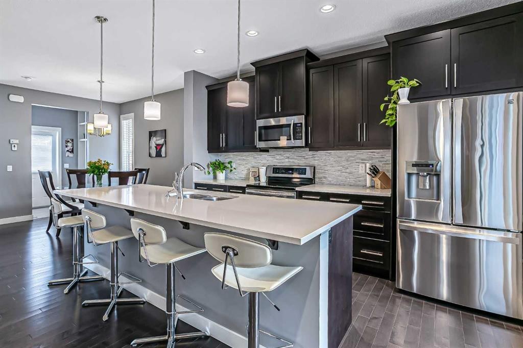 23 Marquis Link Se, Calgary, AB - Indoor Photo Showing Kitchen With Stainless Steel Kitchen With Upgraded Kitchen