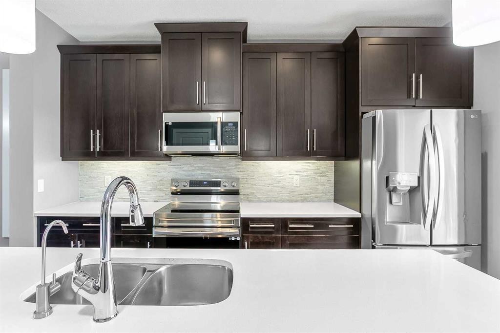 23 Marquis Link Se, Calgary, AB - Indoor Photo Showing Kitchen With Stainless Steel Kitchen With Double Sink With Upgraded Kitchen