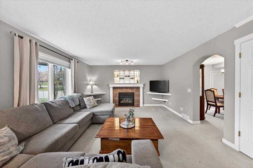 127 Hidden Ranch Terrace Nw, Calgary, AB - Indoor Photo Showing Living Room With Fireplace