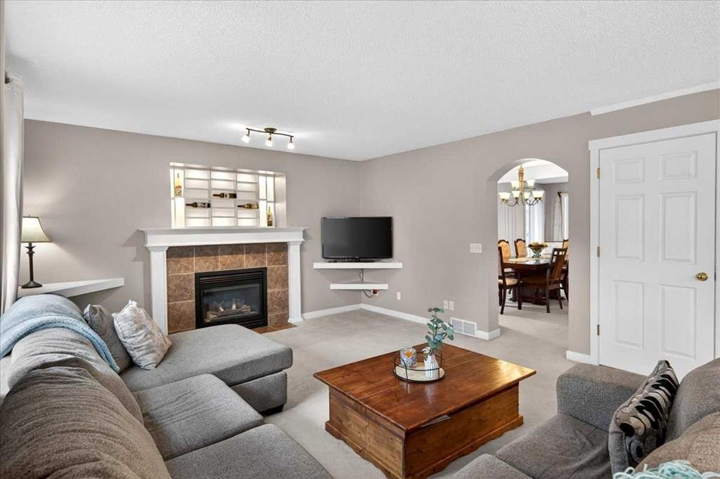 127 Hidden Ranch Terrace Nw, Calgary, AB - Indoor Photo Showing Living Room With Fireplace