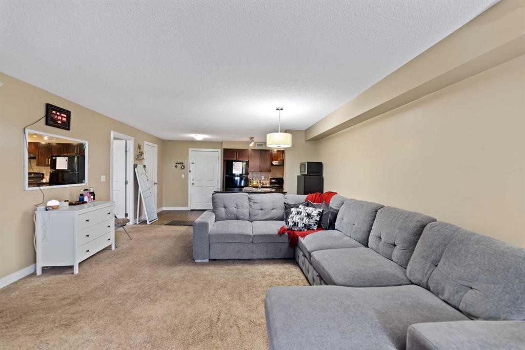 404-355 Taralake Way Ne, Calgary, AB - Indoor Photo Showing Living Room