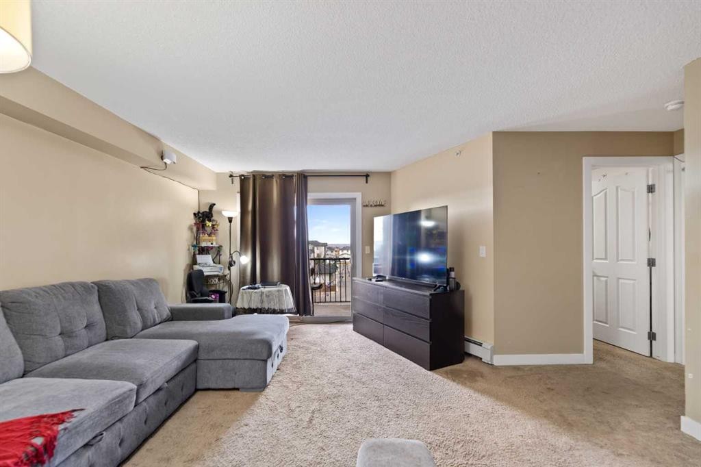 404-355 Taralake Way Ne, Calgary, AB - Indoor Photo Showing Living Room