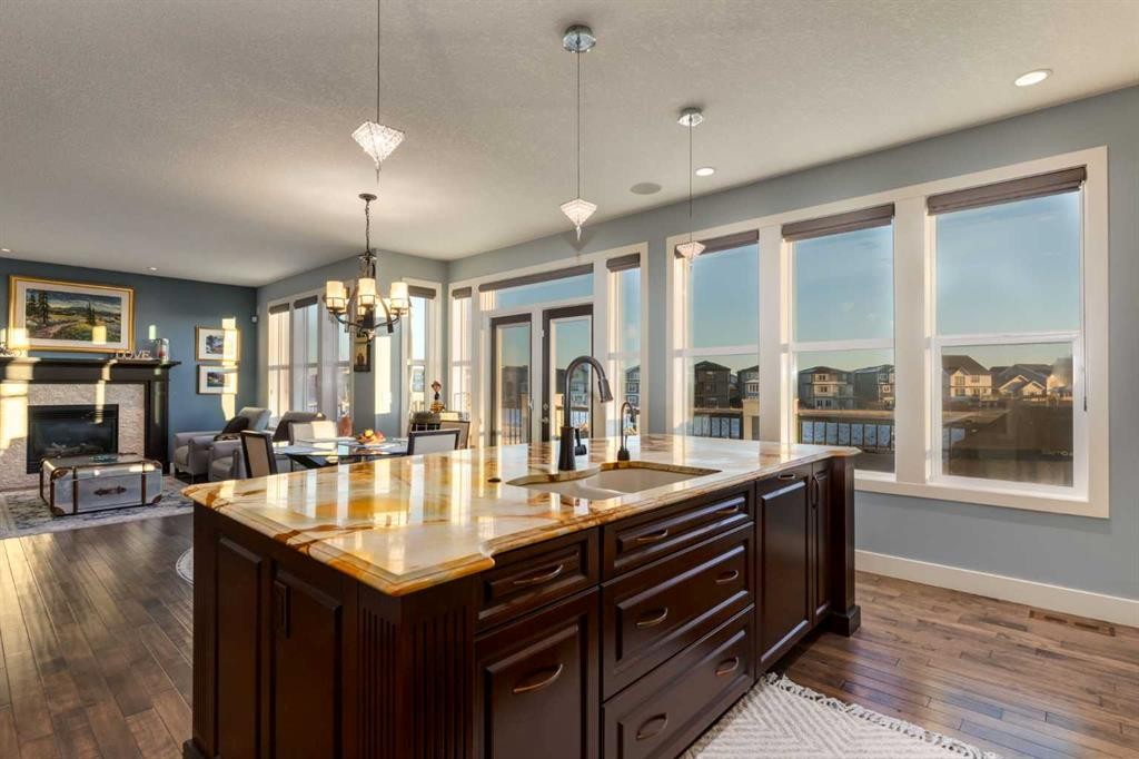 308 Rainbow Falls Way, Chestermere, AB - Indoor Photo Showing Kitchen With Fireplace With Double Sink