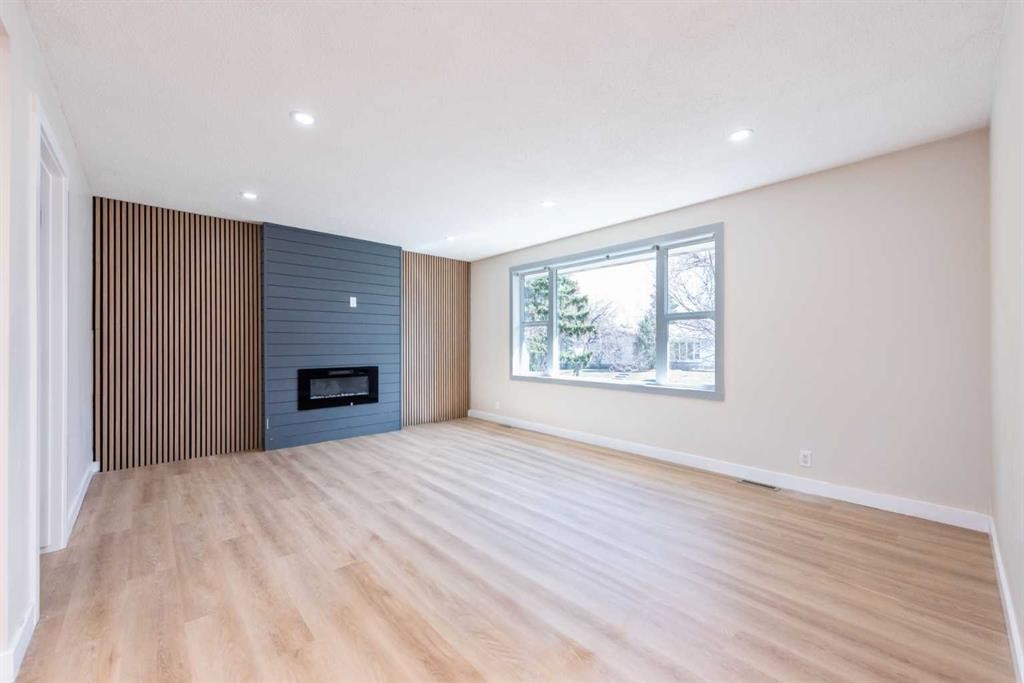 46 Marbrooke Circle Ne, Calgary, AB - Indoor Photo Showing Other Room With Fireplace