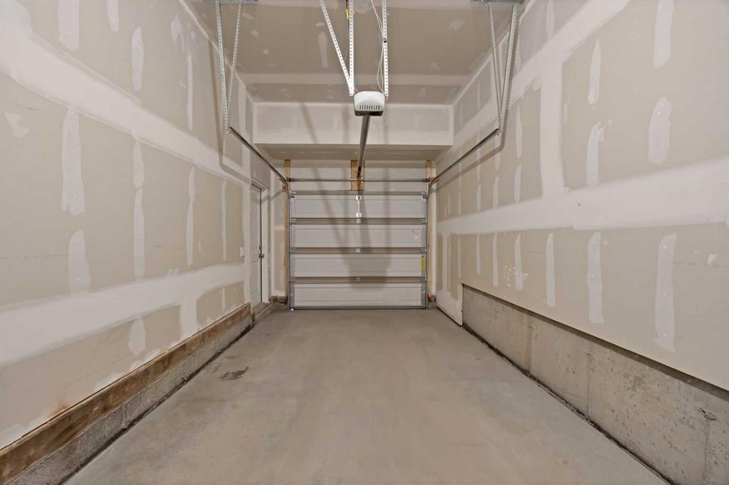 1167 Channelside Drive Sw, Airdrie, AB - Indoor Photo Showing Garage