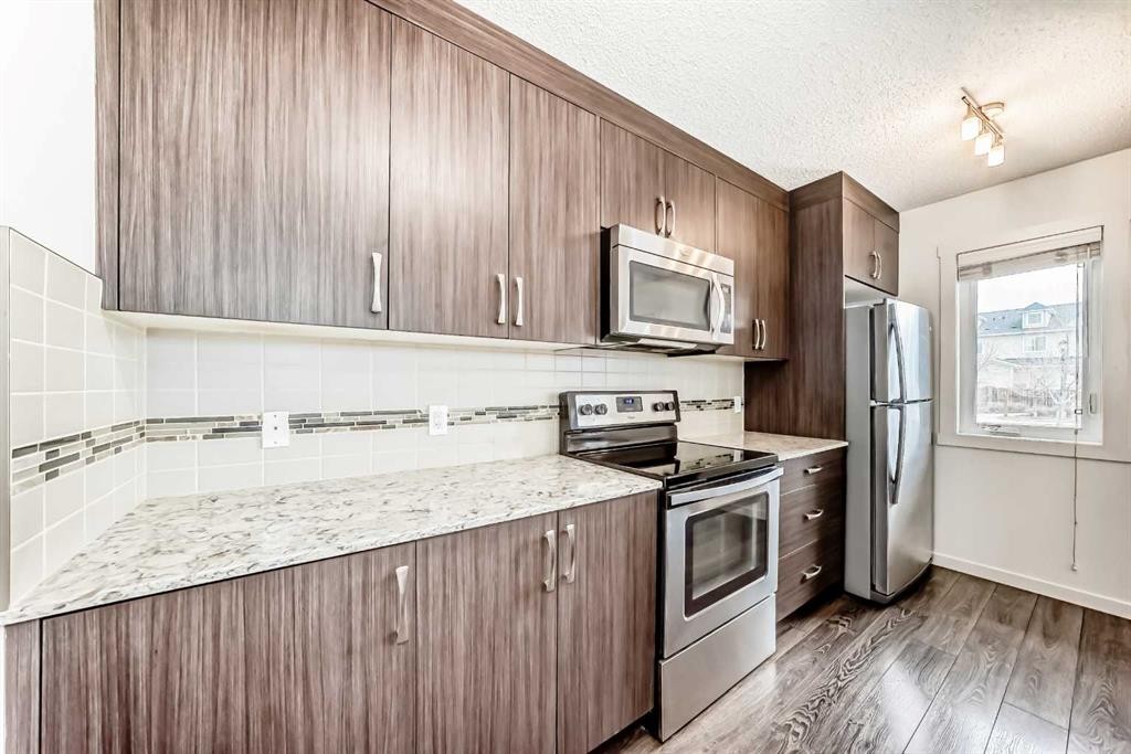 56 Auburn Bay Link Se, Calgary, AB - Indoor Photo Showing Kitchen With Stainless Steel Kitchen