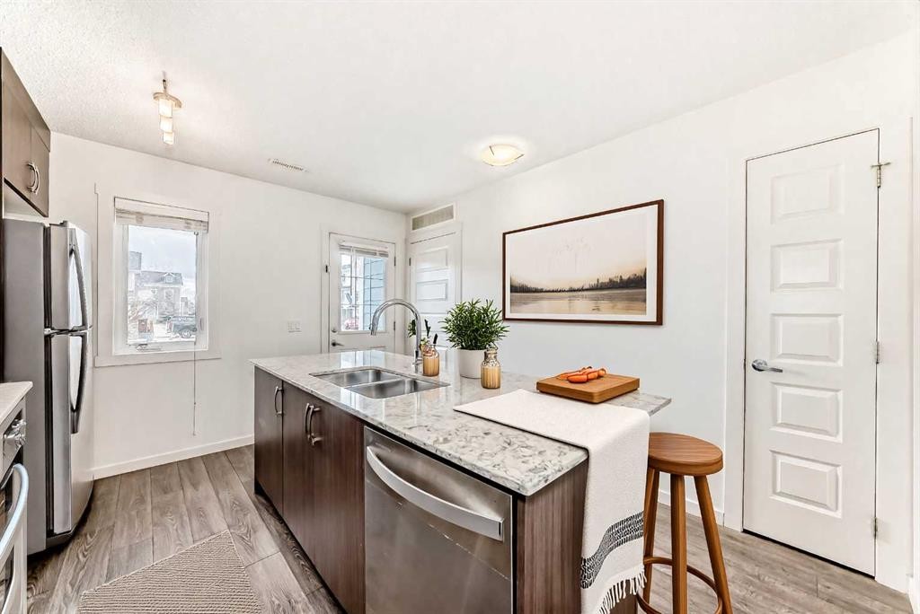 56 Auburn Bay Link Se, Calgary, AB - Indoor Photo Showing Kitchen With Double Sink