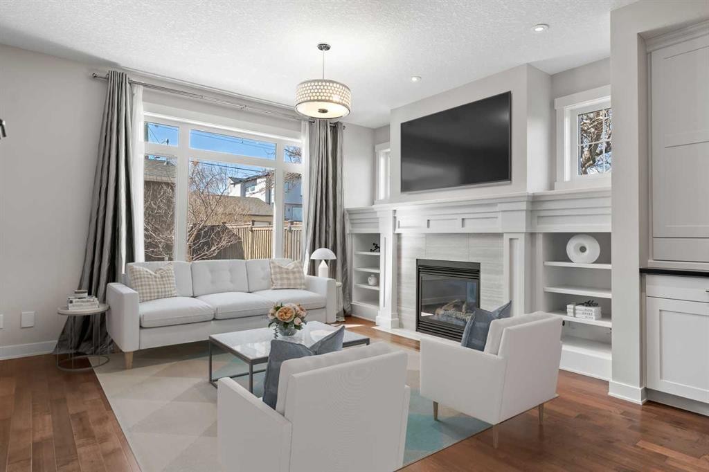 2427 22A Street Nw, Calgary, AB - Indoor Photo Showing Living Room With Fireplace