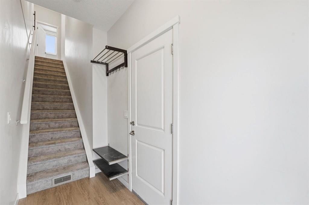 84 Shawnee Common Sw, Calgary, AB - Indoor Photo Showing Other Room