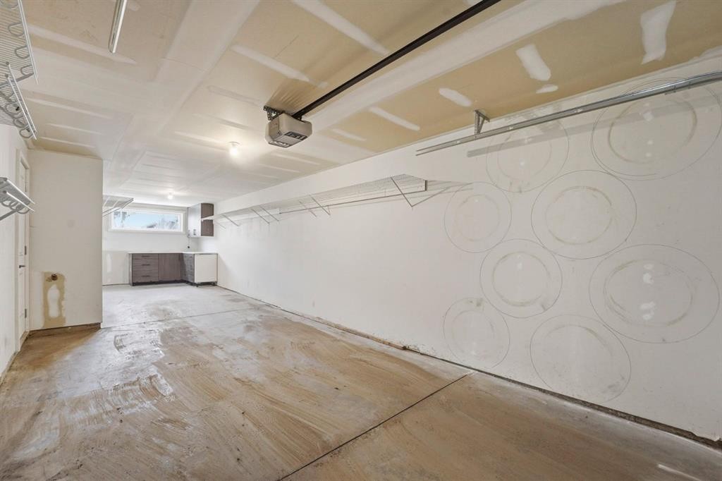 84 Shawnee Common Sw, Calgary, AB - Indoor Photo Showing Garage