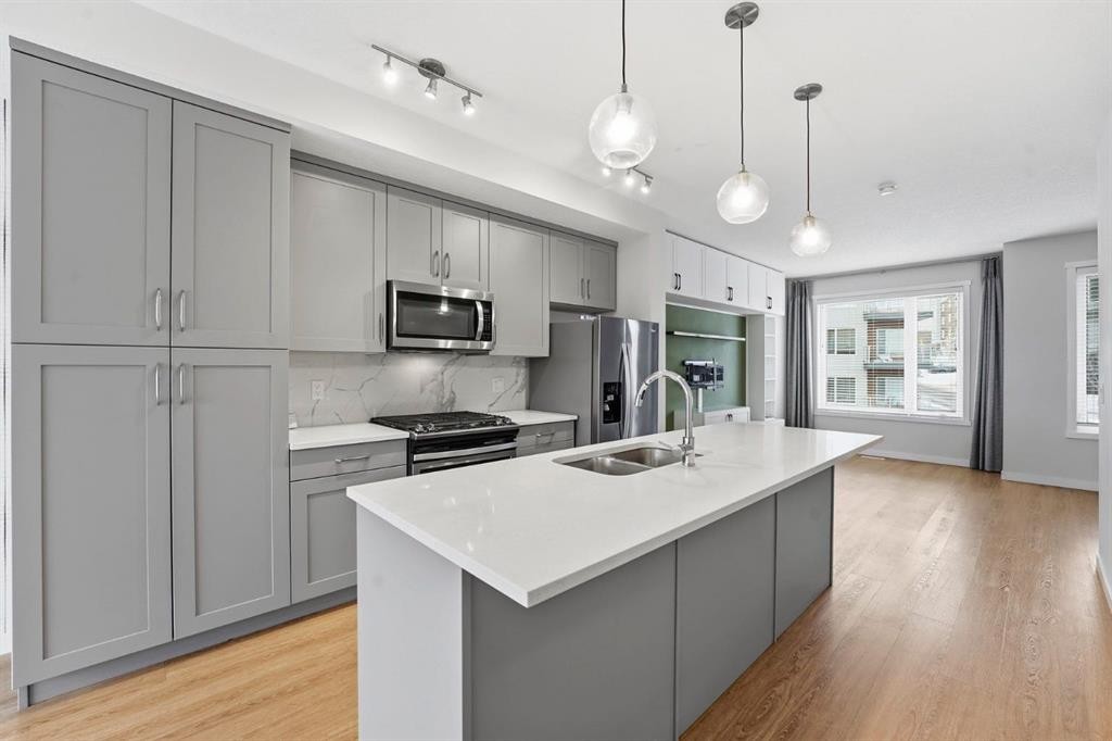 84 Shawnee Common Sw, Calgary, AB - Indoor Photo Showing Kitchen With Double Sink With Upgraded Kitchen