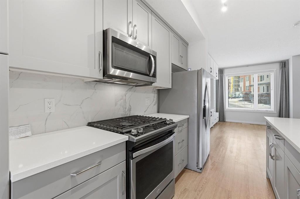 84 Shawnee Common Sw, Calgary, AB - Indoor Photo Showing Kitchen With Upgraded Kitchen