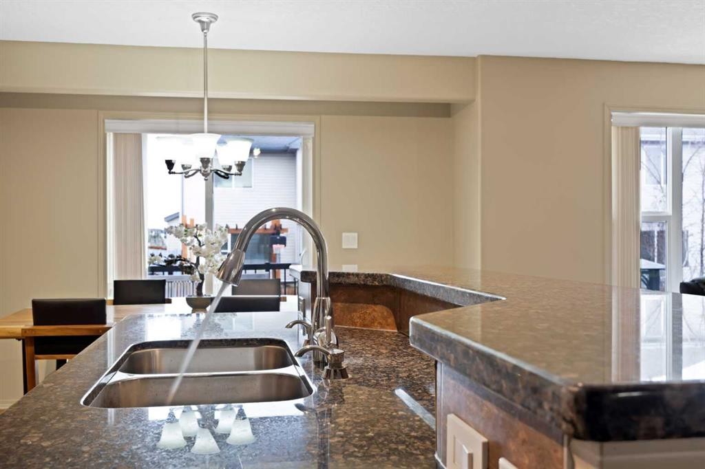 10 Bridlerange Circle Sw, Calgary, AB - Indoor Photo Showing Kitchen With Double Sink