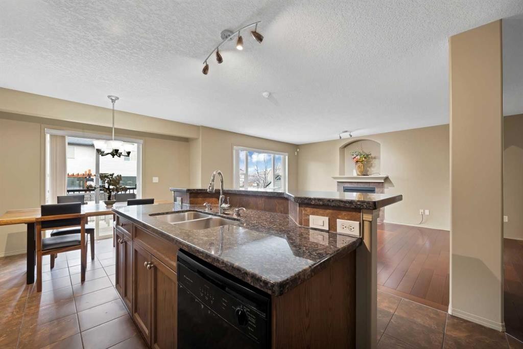10 Bridlerange Circle Sw, Calgary, AB - Indoor Photo Showing Kitchen With Double Sink