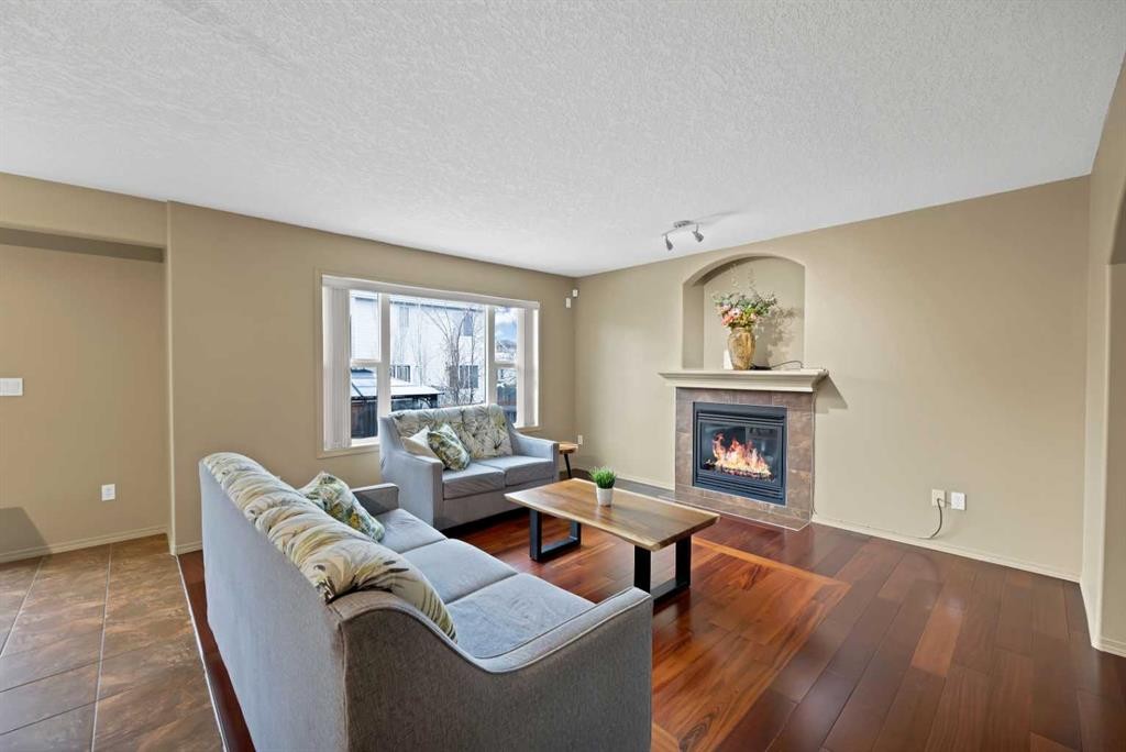 10 Bridlerange Circle Sw, Calgary, AB - Indoor Photo Showing Living Room With Fireplace