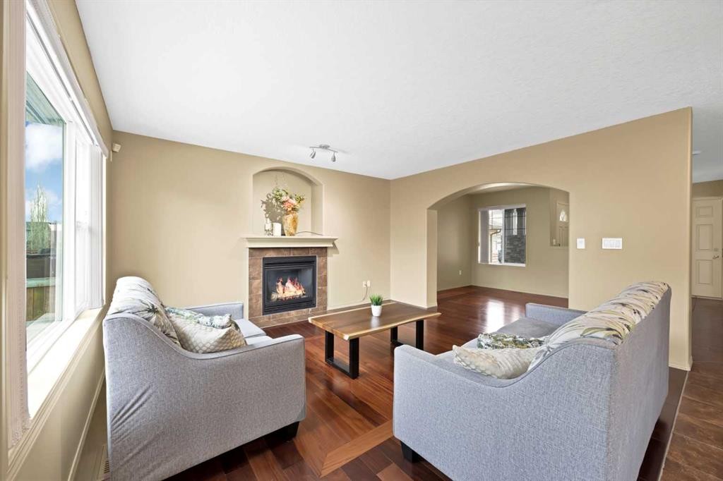 10 Bridlerange Circle Sw, Calgary, AB - Indoor Photo Showing Living Room With Fireplace