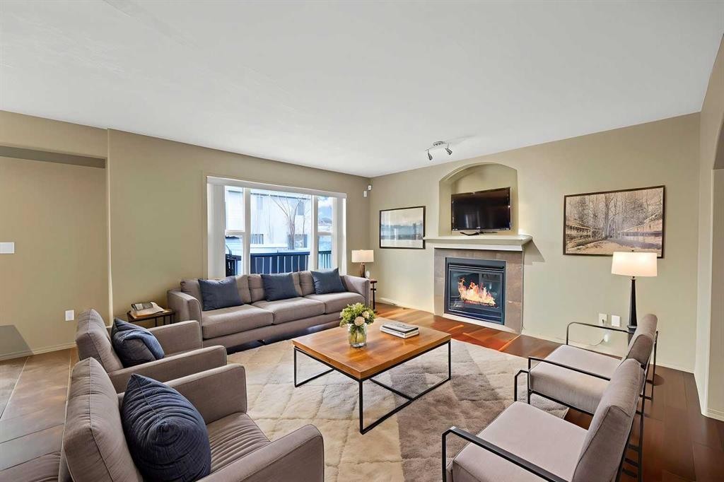 10 Bridlerange Circle Sw, Calgary, AB - Indoor Photo Showing Living Room With Fireplace