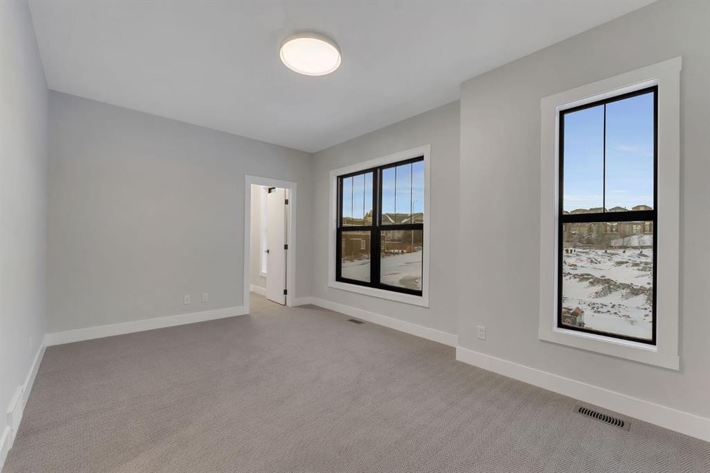 12 Spring Creek Point Sw, Calgary, AB - Indoor Photo Showing Other Room