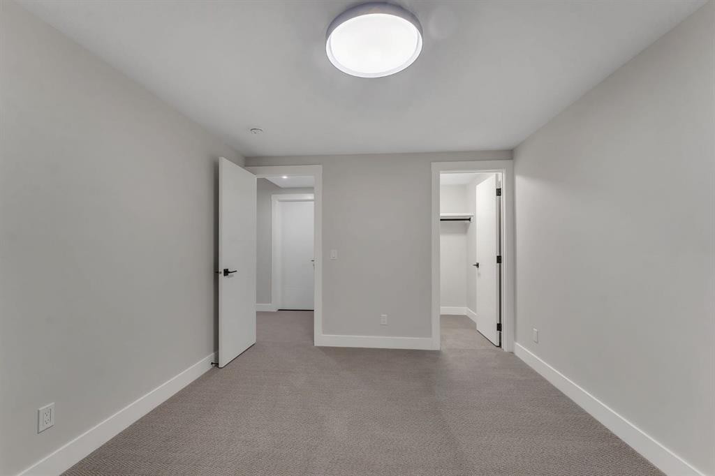 12 Spring Creek Point Sw, Calgary, AB - Indoor Photo Showing Other Room