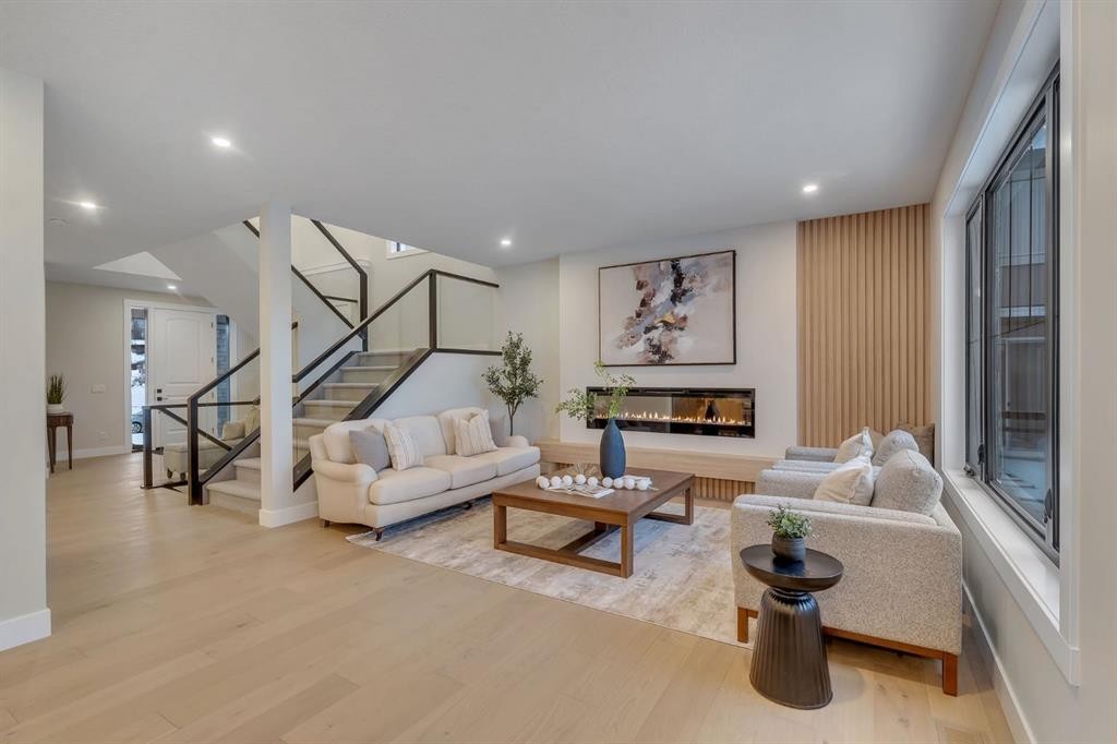 12 Spring Creek Point Sw, Calgary, AB - Indoor Photo Showing Living Room With Fireplace