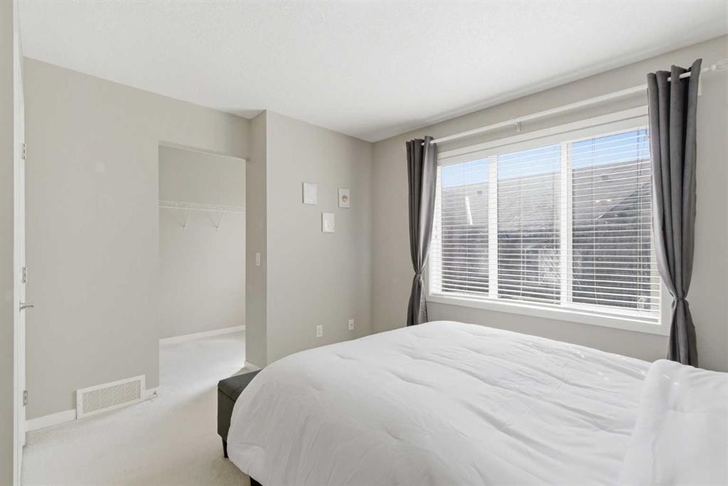 150 Copperpond Villas Se, Calgary, AB - Indoor Photo Showing Bedroom