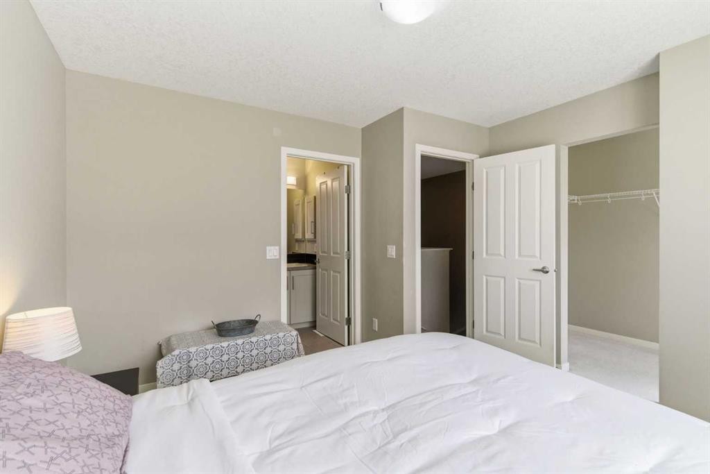 150 Copperpond Villas Se, Calgary, AB - Indoor Photo Showing Bedroom