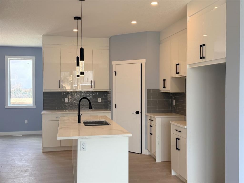1995 Mccaskill Drive, Crossfield, AB - Indoor Photo Showing Kitchen With Double Sink