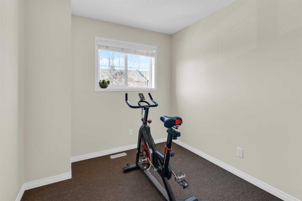 112 Ranch Ridge Meadow, Strathmore, AB - Indoor Photo Showing Gym Room