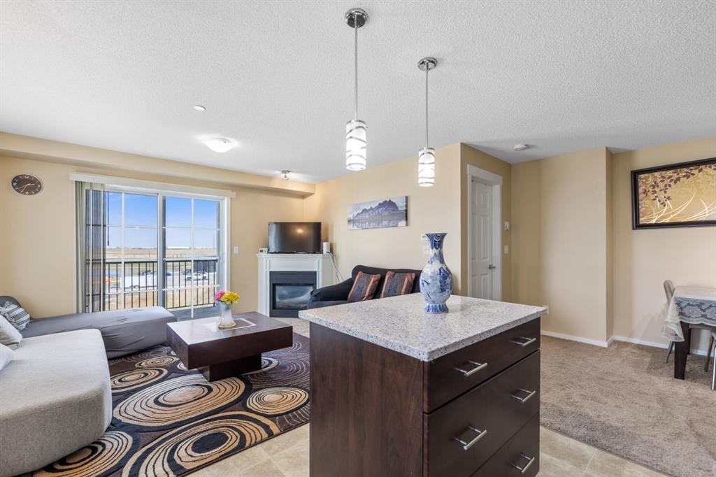 3306-279 Copperpond Common Se, Calgary, AB - Indoor With Fireplace