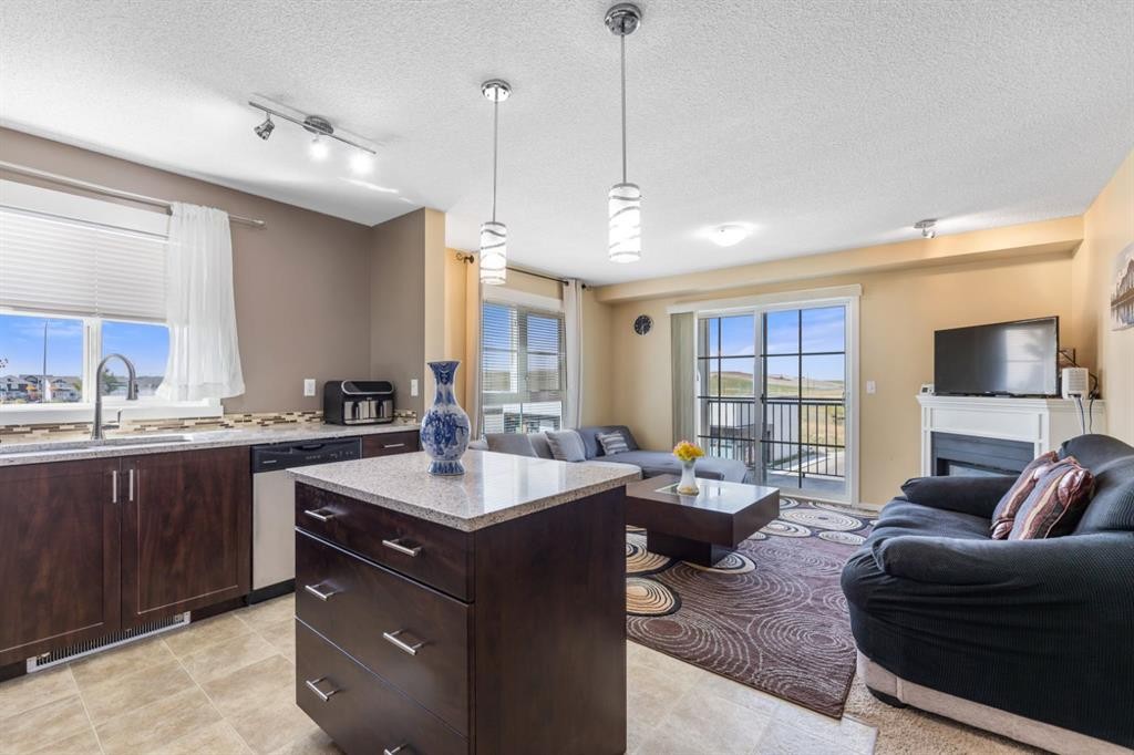3306-279 Copperpond Common Se, Calgary, AB - Indoor With Fireplace