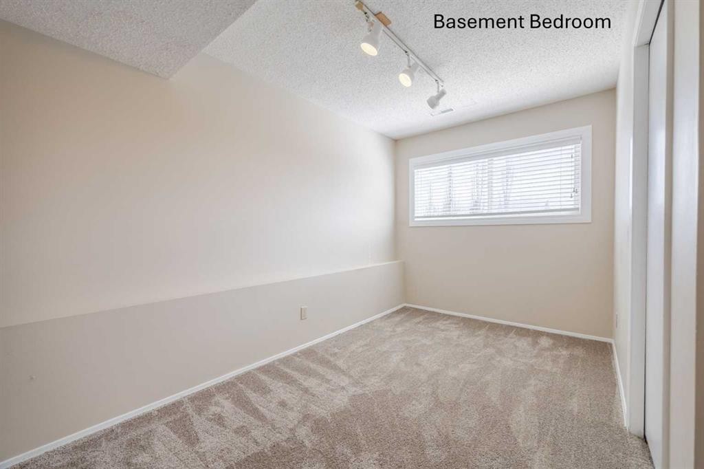 128 Silver Ridge, Calgary, AB - Indoor Photo Showing Other Room