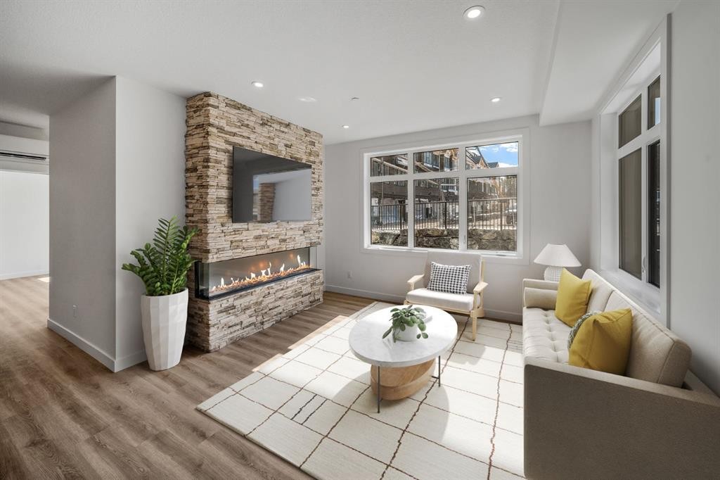 104-10 Cascade Ridge, Canmore, AB - Indoor Photo Showing Living Room With Fireplace