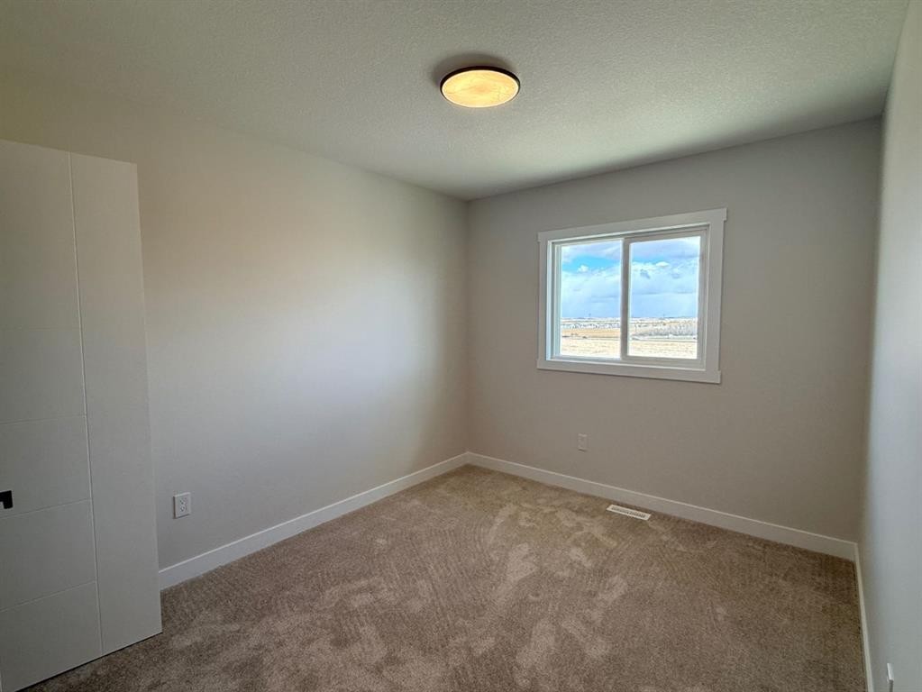 1927 Mccaskill Drive, Crossfield, AB - Indoor Photo Showing Other Room