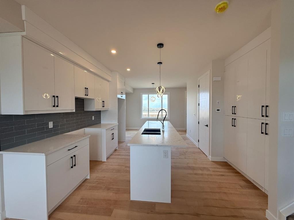 1927 Mccaskill Drive, Crossfield, AB - Indoor Photo Showing Kitchen With Double Sink With Upgraded Kitchen