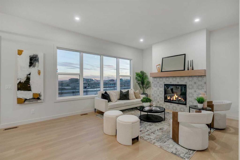 341 Limestone Bay, Balzac, AB - Indoor Photo Showing Living Room With Fireplace