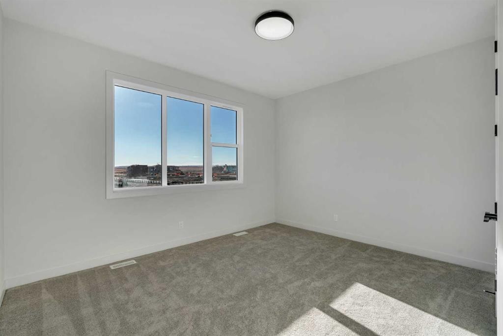 341 Limestone Bay, Balzac, AB - Indoor Photo Showing Other Room