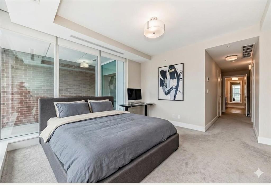 554 Riverfront Lane Se, Calgary, AB - Indoor Photo Showing Bedroom
