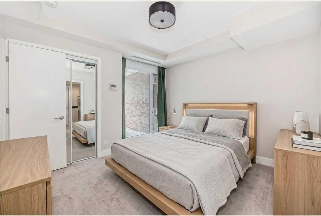 554 Riverfront Lane Se, Calgary, AB - Indoor Photo Showing Bedroom
