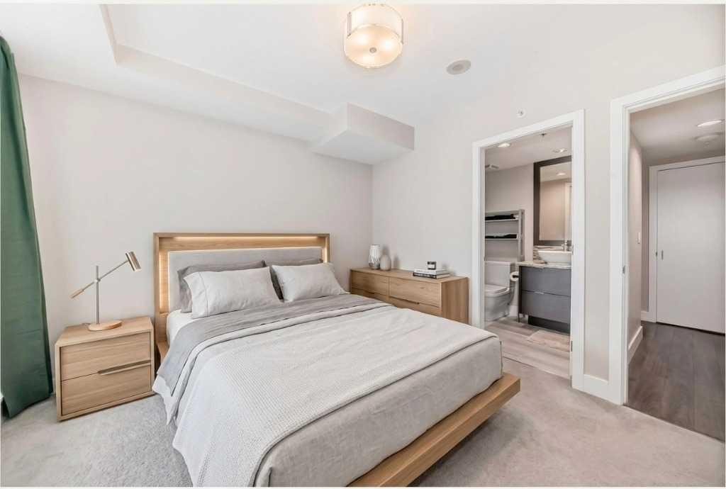 554 Riverfront Lane Se, Calgary, AB - Indoor Photo Showing Bedroom