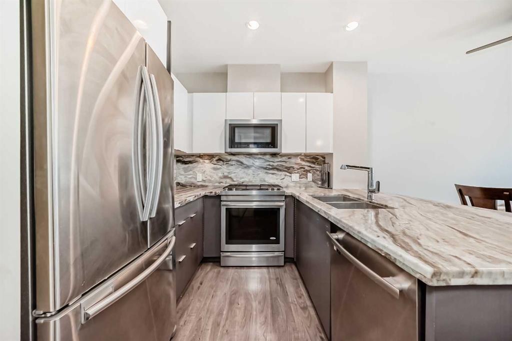 554 Riverfront Lane Se, Calgary, AB - Indoor Photo Showing Kitchen With Double Sink With Upgraded Kitchen