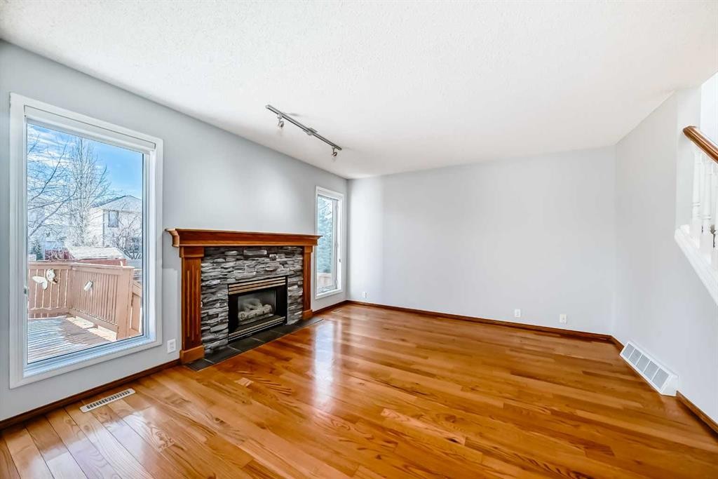 128 Harvest Park Road Ne, Calgary, AB - Indoor Photo Showing Living Room With Fireplace
