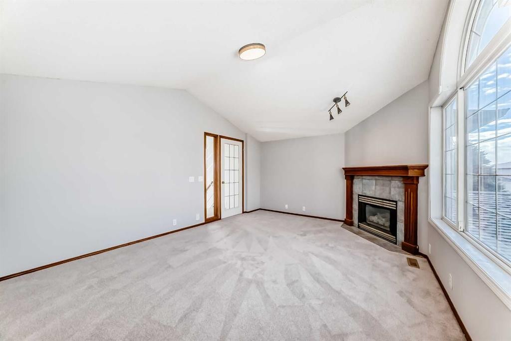 128 Harvest Park Road Ne, Calgary, AB - Indoor With Fireplace