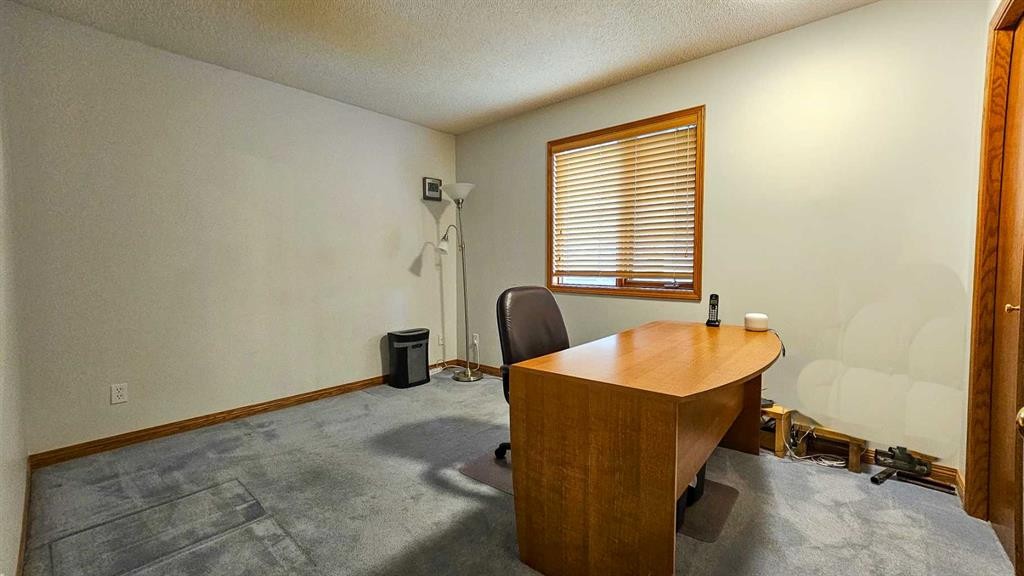 393 Hawktree Circle Nw, Calgary, AB - Indoor With Fireplace