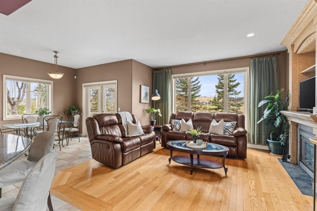 140 Simcoe Close Sw, Calgary, AB - Indoor Photo Showing Living Room With Fireplace