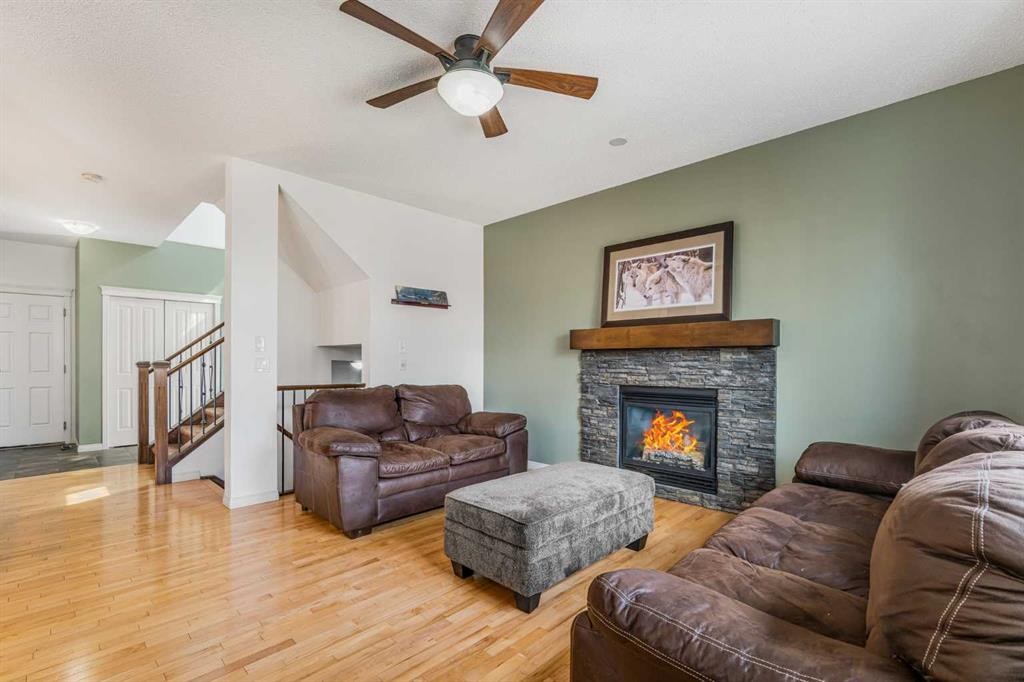 76 Heritage Hill, Cochrane, AB - Indoor Photo Showing Living Room With Fireplace