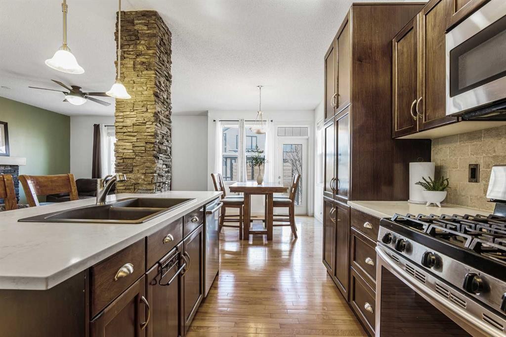76 Heritage Hill, Cochrane, AB - Indoor Photo Showing Kitchen With Double Sink With Upgraded Kitchen