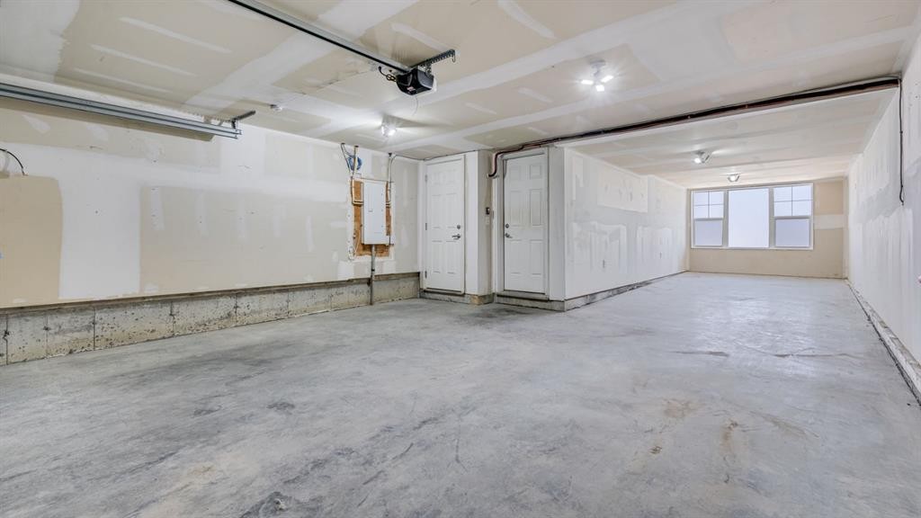 205 Sundown Road, Cochrane, AB - Indoor Photo Showing Garage