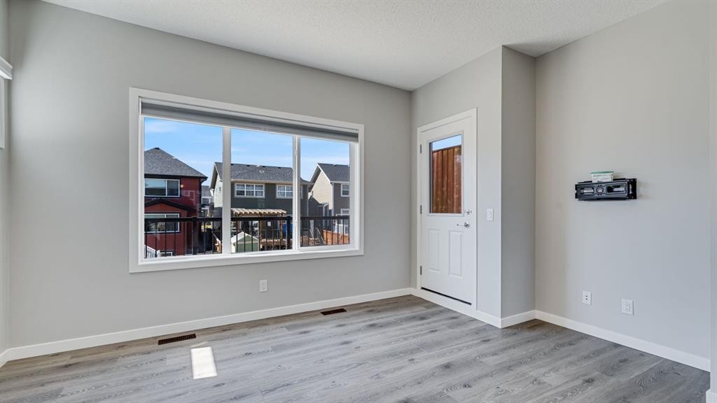 205 Sundown Road, Cochrane, AB - Indoor Photo Showing Other Room