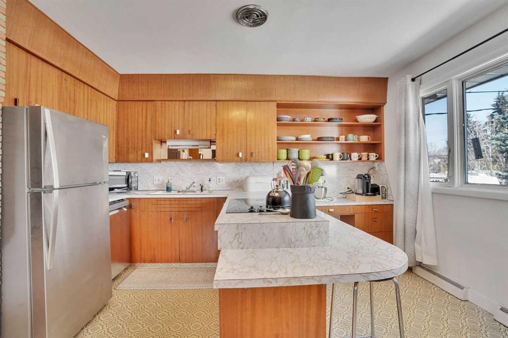 36 Malibou Road Sw, Calgary, AB - Indoor Photo Showing Kitchen With Double Sink