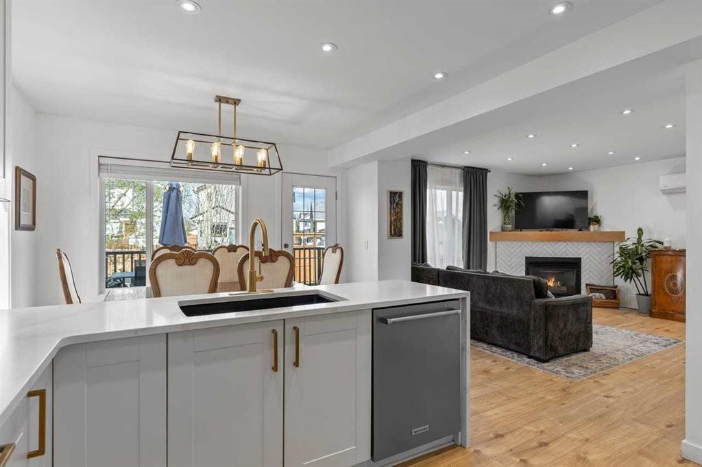 72 Crystalridge Crescent, Okotoks, AB - Indoor Photo Showing Kitchen With Fireplace